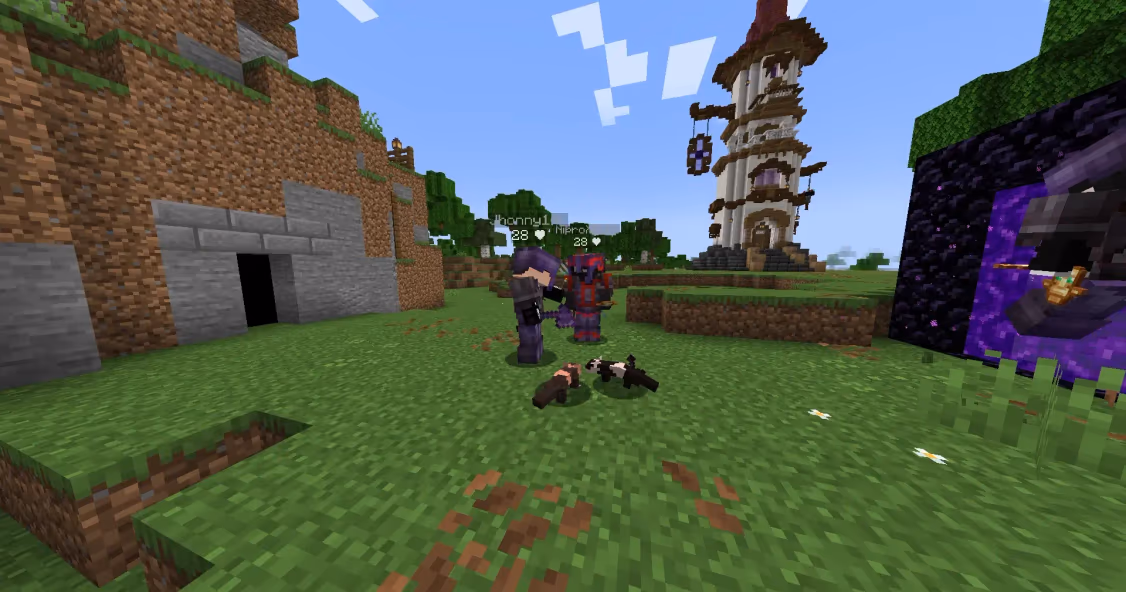 two players at spawn with 2 meerkats in Minecraft